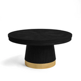Black round coffee table with a gold base on a white background