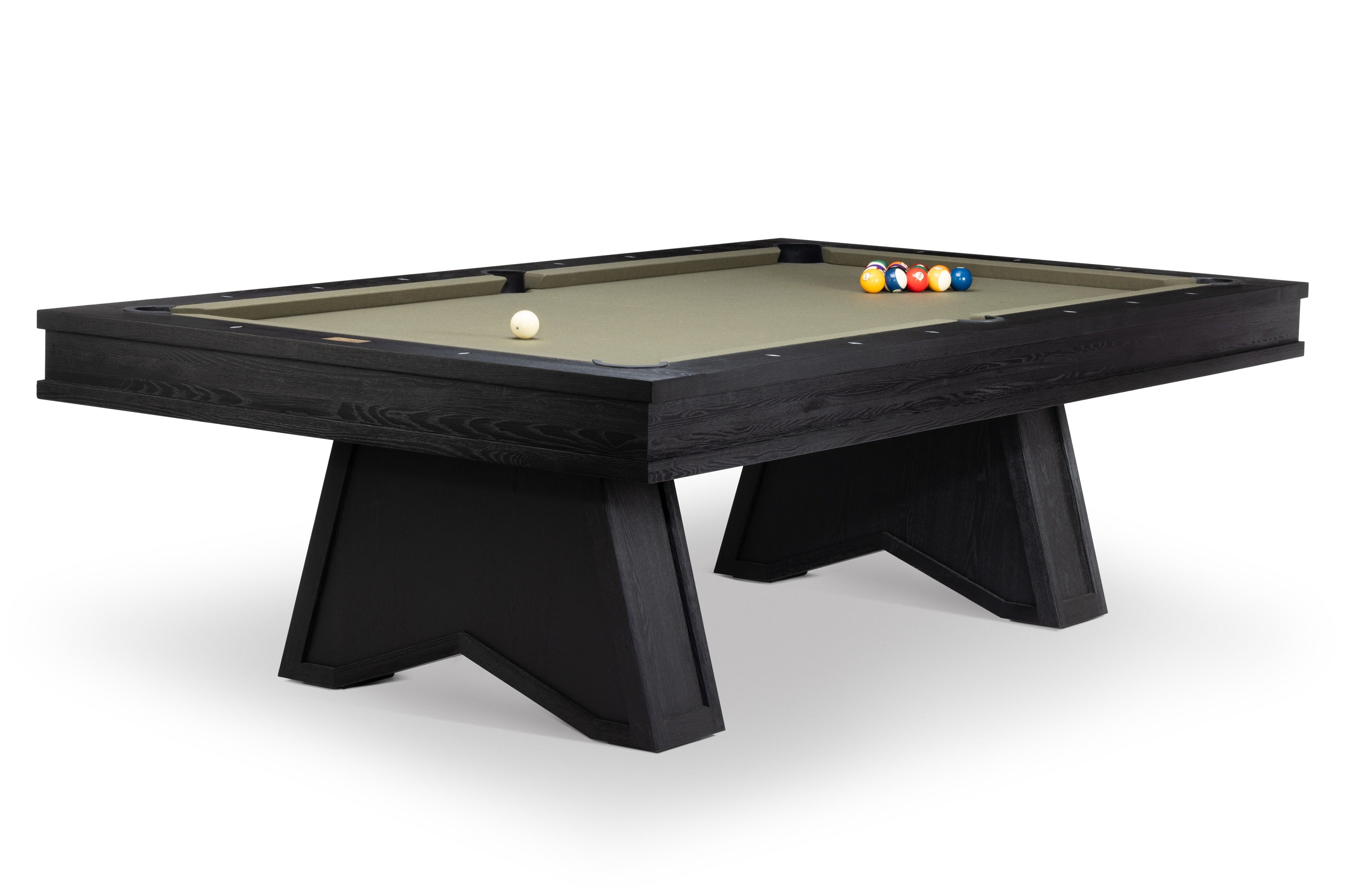 A black wood pool table with a light beige felt surface, featuring a white cue ball and a set of colorful billiard balls on the table, photographed on a clean white background.