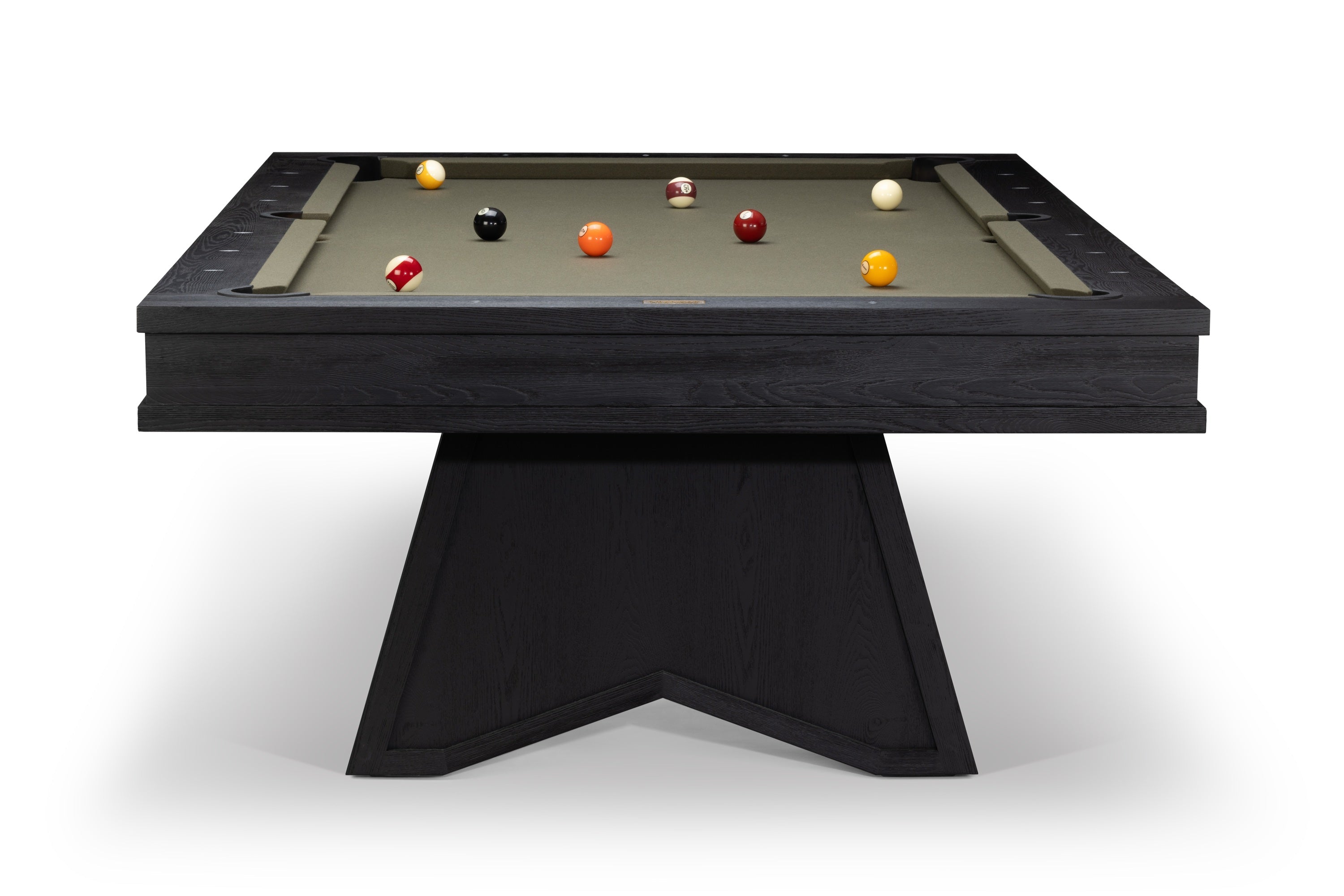 A modern dark wood pool table with a black triangular pedestal base and a light beige felt surface, shown from a high angle on a white background.