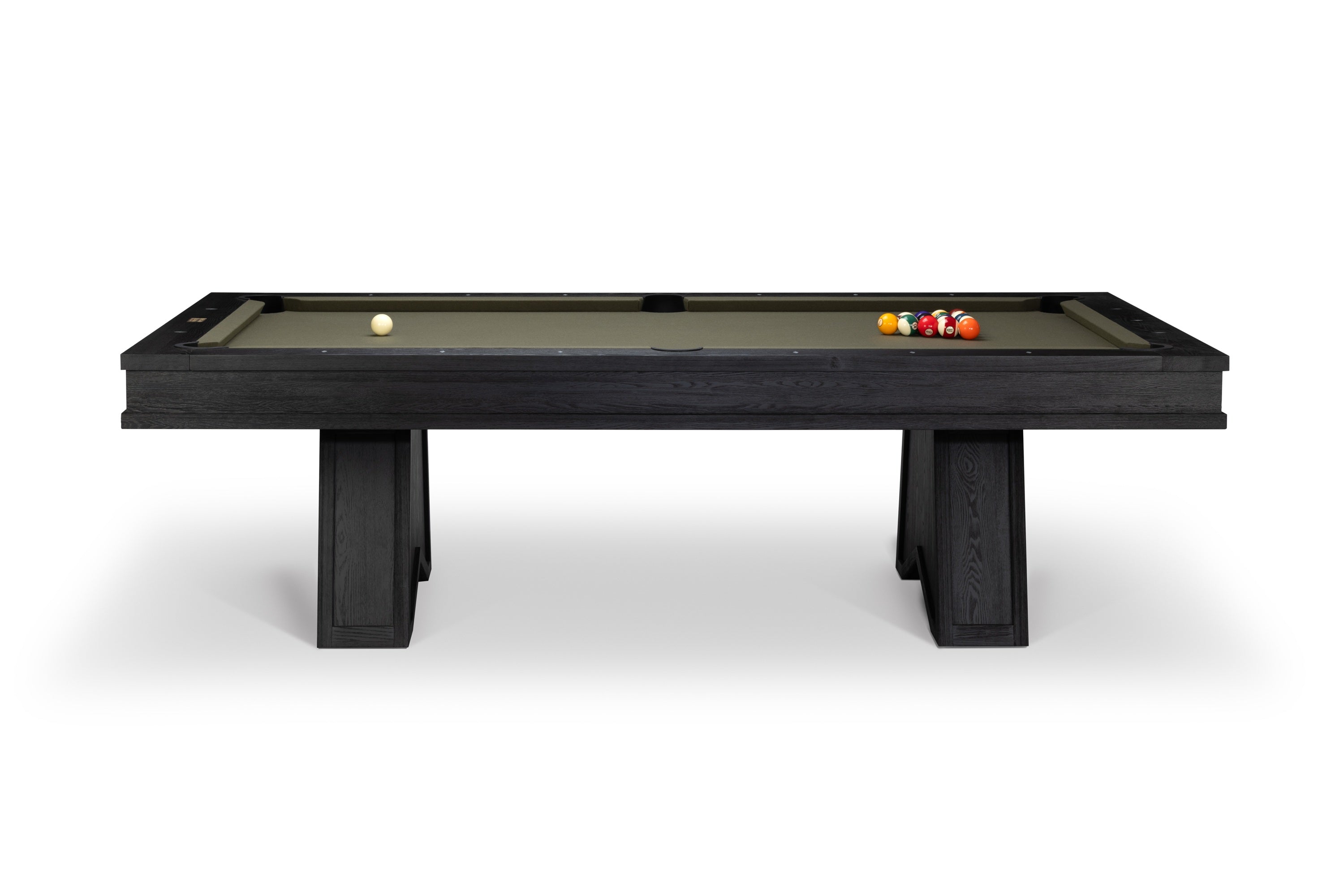 A modern pool table with a dark wood frame and a green felt surface, shown from a side angle on a white background with a few billiard balls on the table.