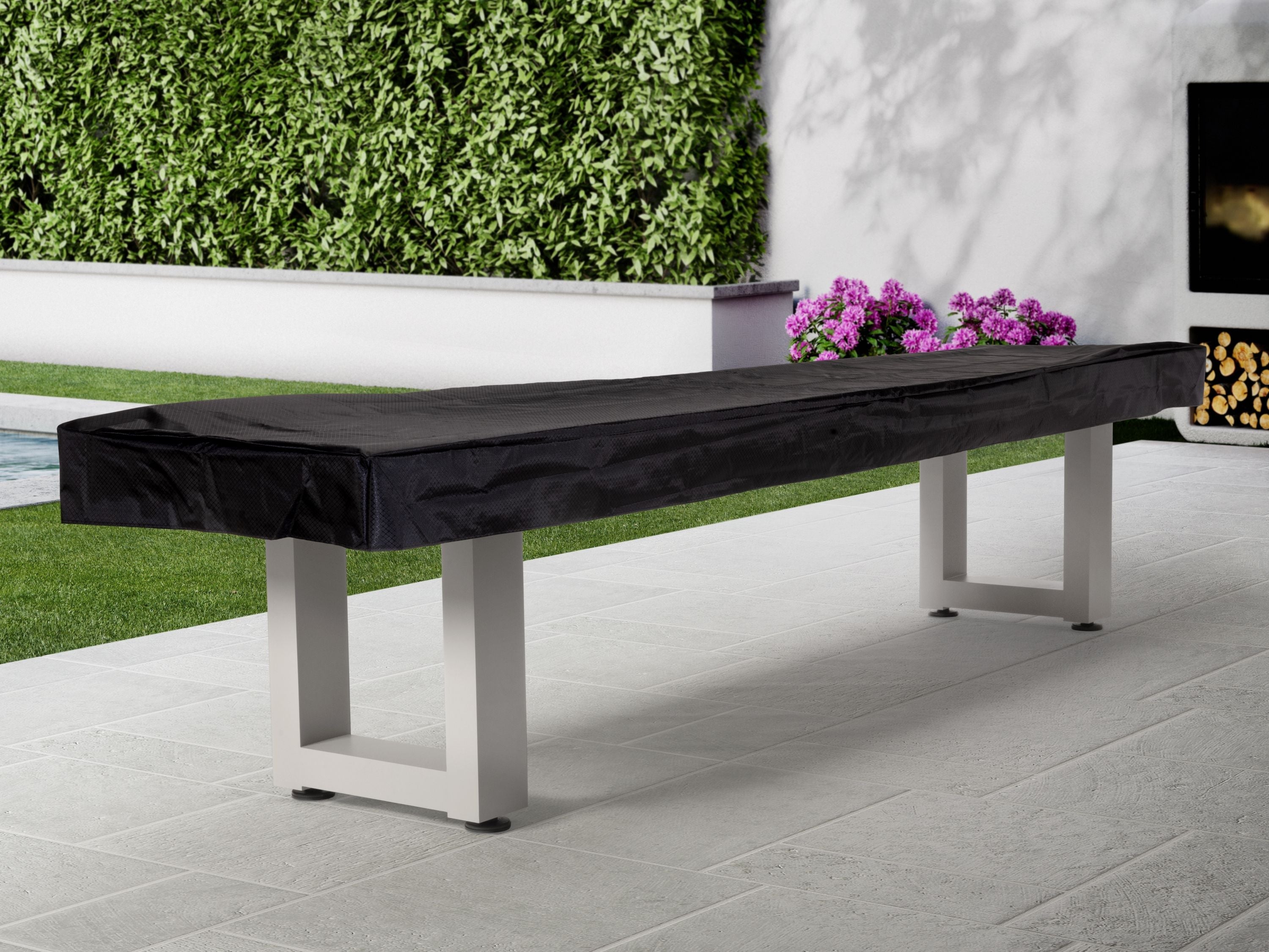 Long outdoor bench beside grass, near an American Heritage Lanai 9' Shuffleboard Table.