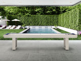 American Heritage Lanai 12' Oyster Grey Shuffleboard Table by the pool with lounge chairs.