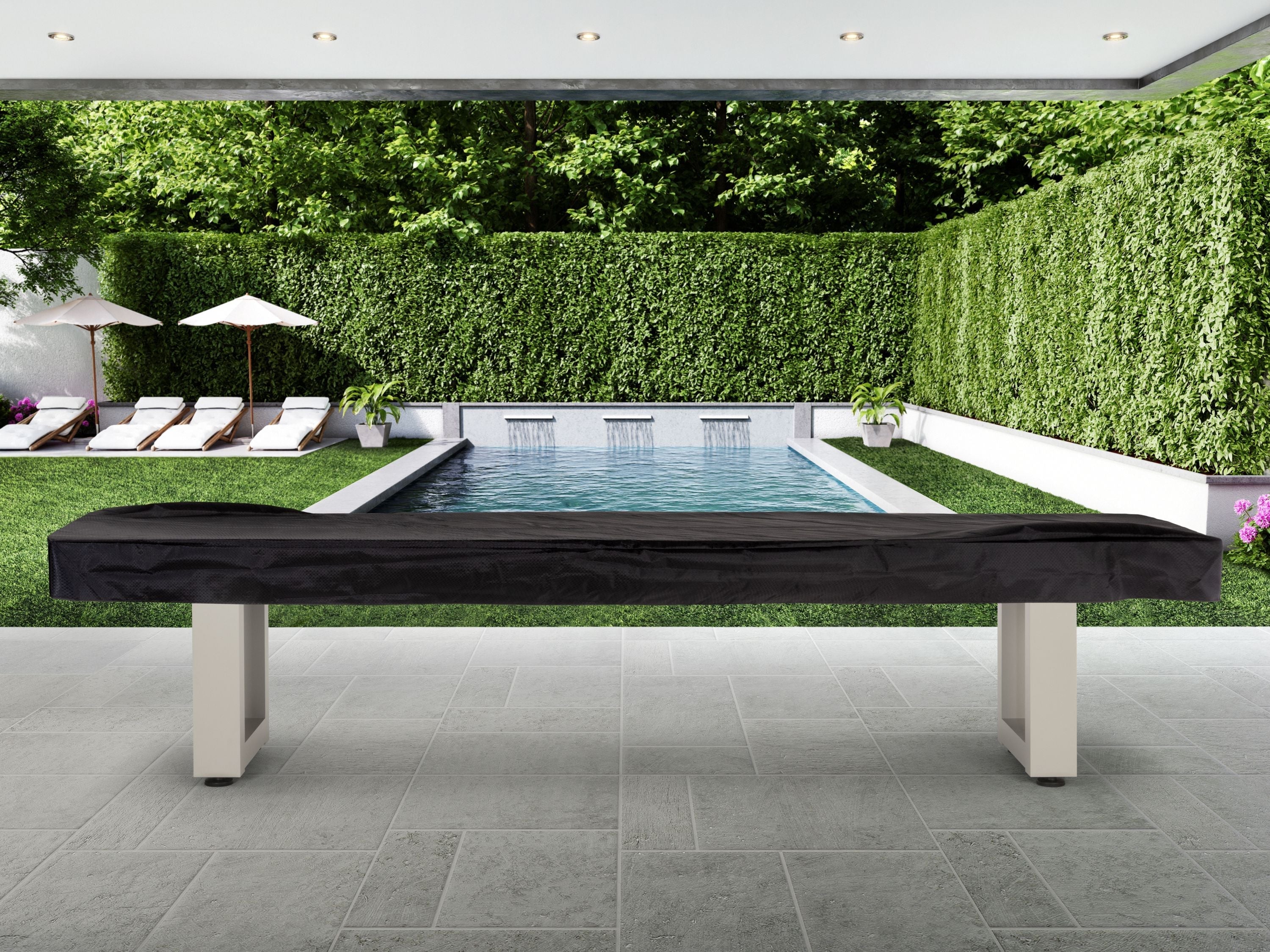 American Heritage Lanai 12' Oyster Grey shuffleboard table on patio, pool and lounge chairs behind.