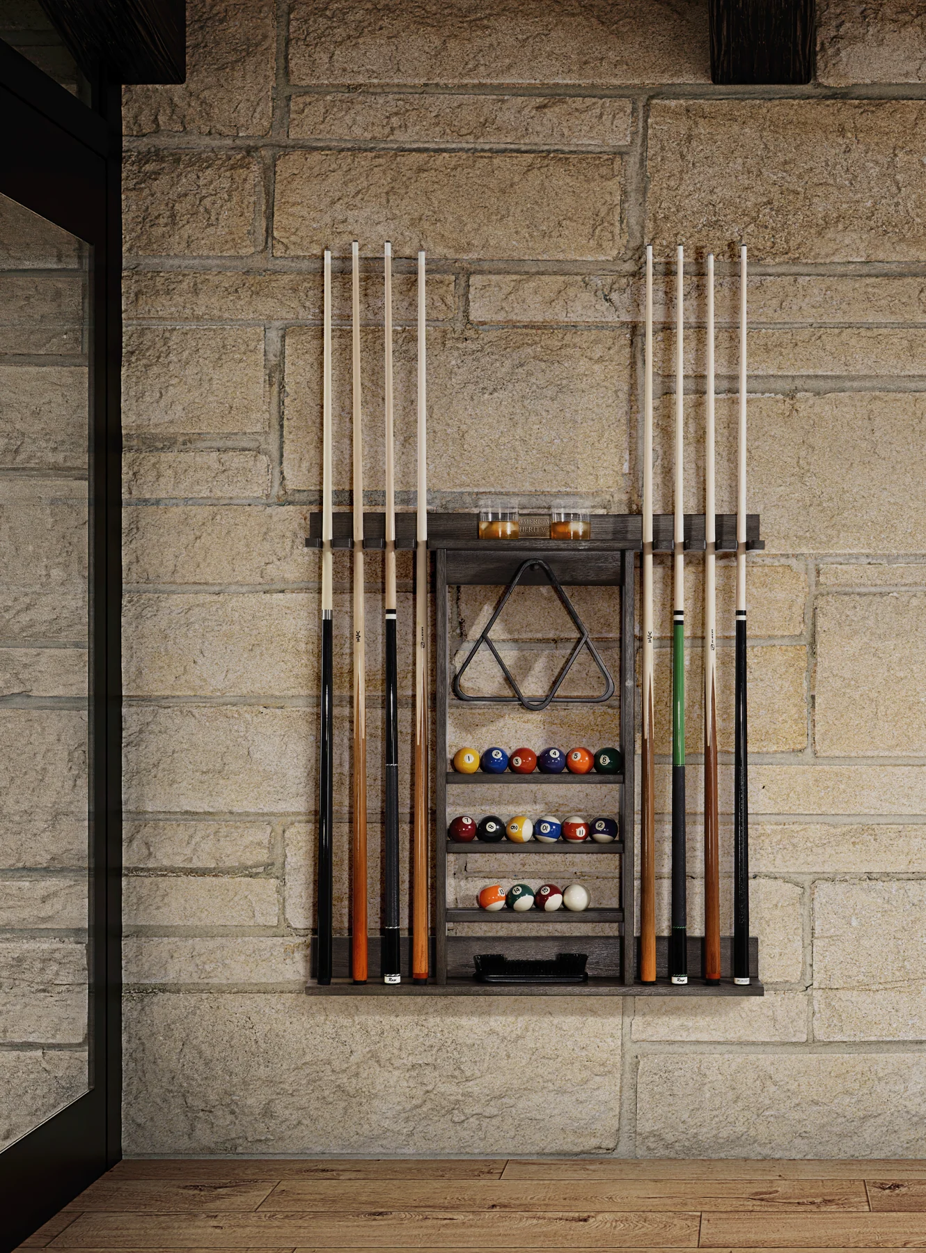 Wall-mounted pool cue and ball holder against a stone wall.