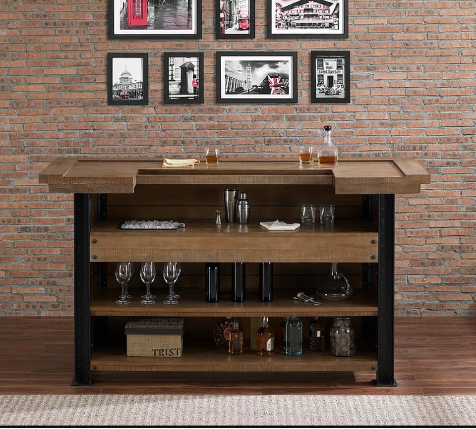 The American Heritage Billiards Gateway Bar displays glasses and bottles against a brick wall.