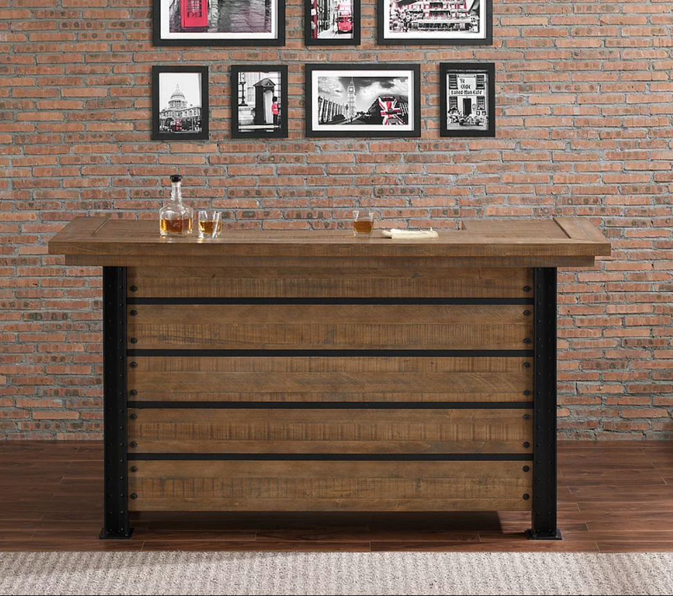 American Heritage Billiards Gateway Bar with drinks, set against brick wall with framed photos.