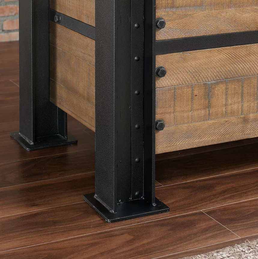 Close-up of American Heritage Billiards Gateway Bar leg with metal and wood on dark flooring.
